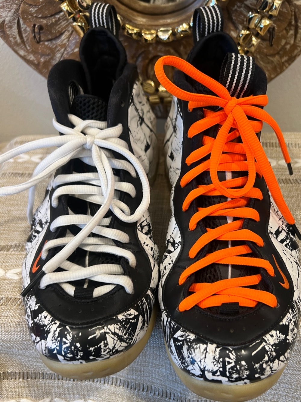 Nike Air Foamposite One "Shattered Backboard" sneakers.  Orange and White Laces.